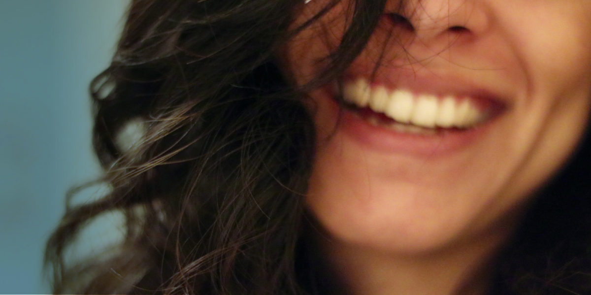 woman brown hair smiling