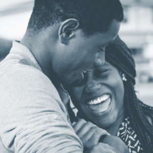 adult couple laughing & smiling