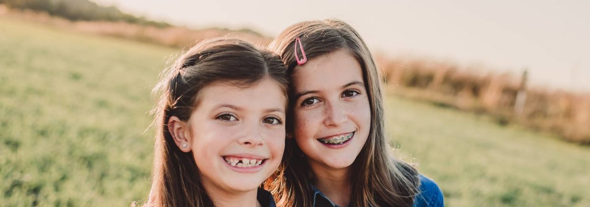 Ferri girls smiling in field