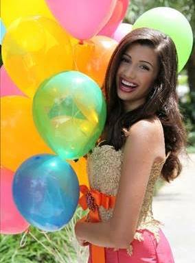 Jeanette Morelan Woman with Balloons and a Great Smile Thanks to Moles & Ferri