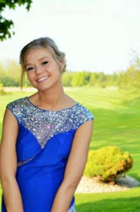 girl smiling in blue dress