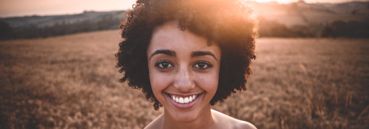 girl smiling in field