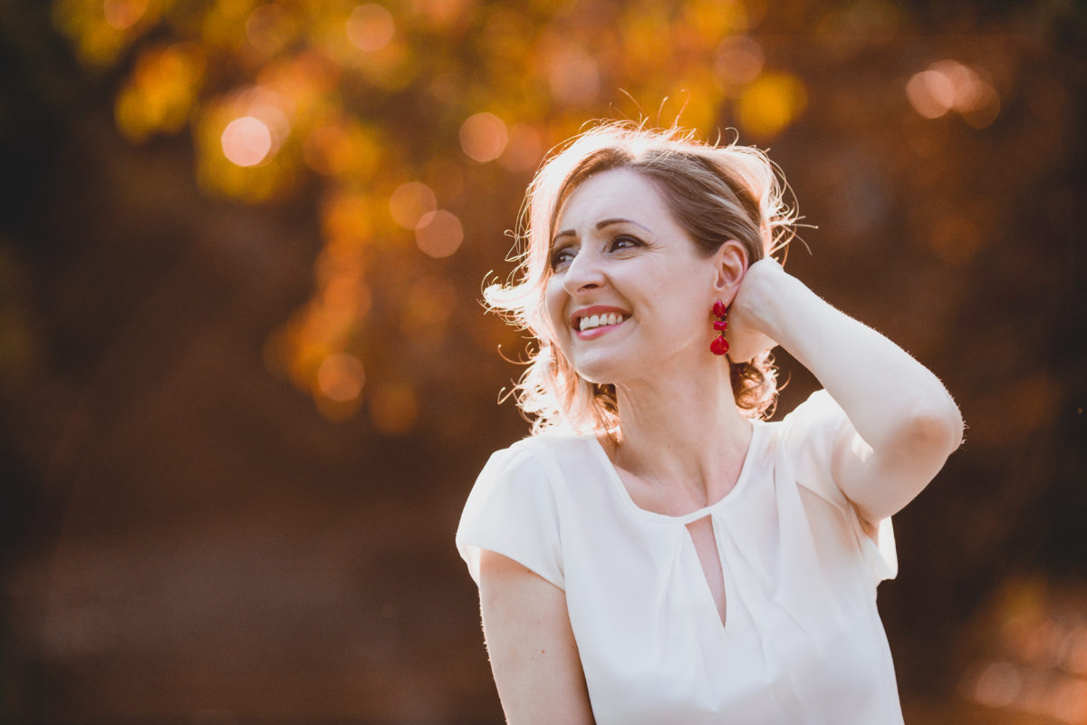 girl in white shirt smiling