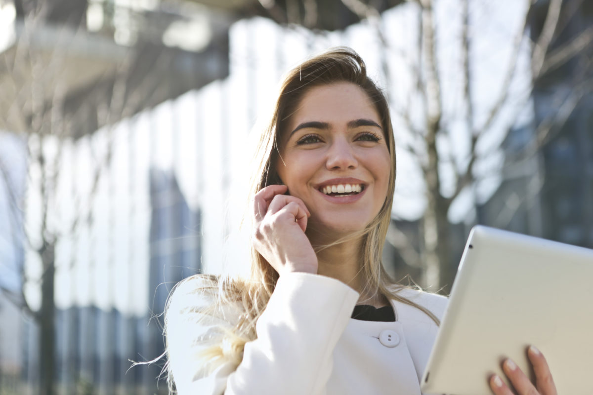 girl on phone smiling