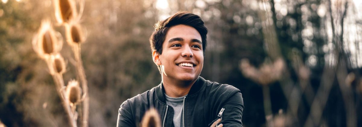 boy smiling in field