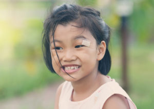 cute little girl smiling with slightly misaligned teeth