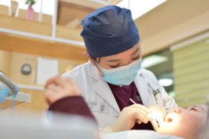 Doctor working on patient's mouth